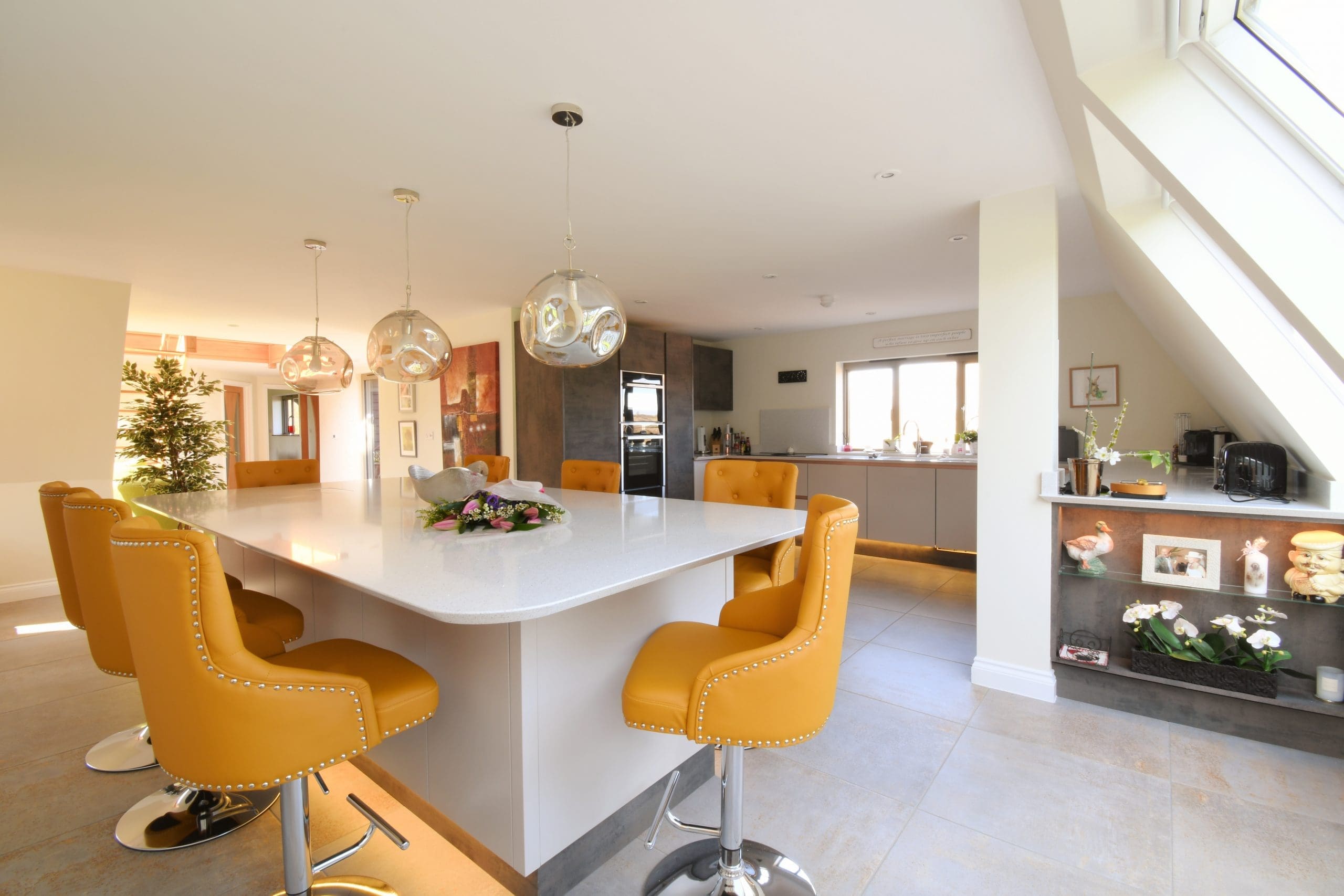 Oxide and Cashmere Kitchen with Flowers Two Tone with Neff Ovens and Central Island with Quartz Worktops Stonemill Kitchens