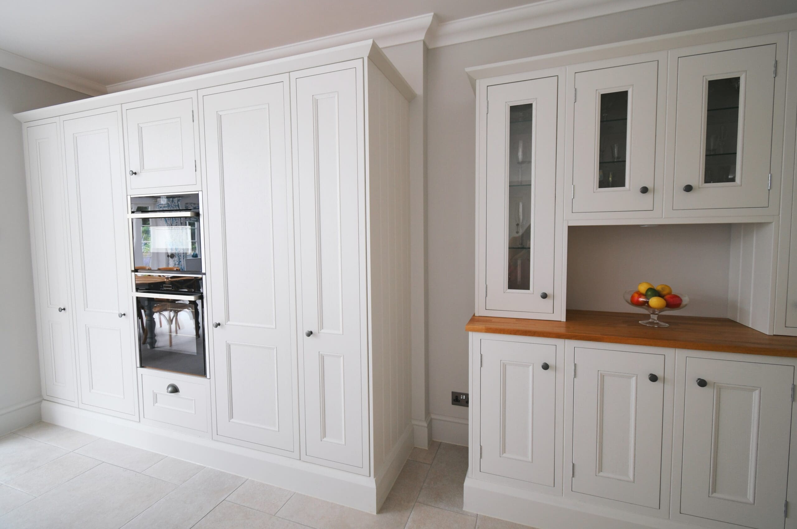 Porcelain Oven Housing Neff Ovens, Inframe Kitchen with Dresser Unit and Wood Worktop Stonemill Kitchens