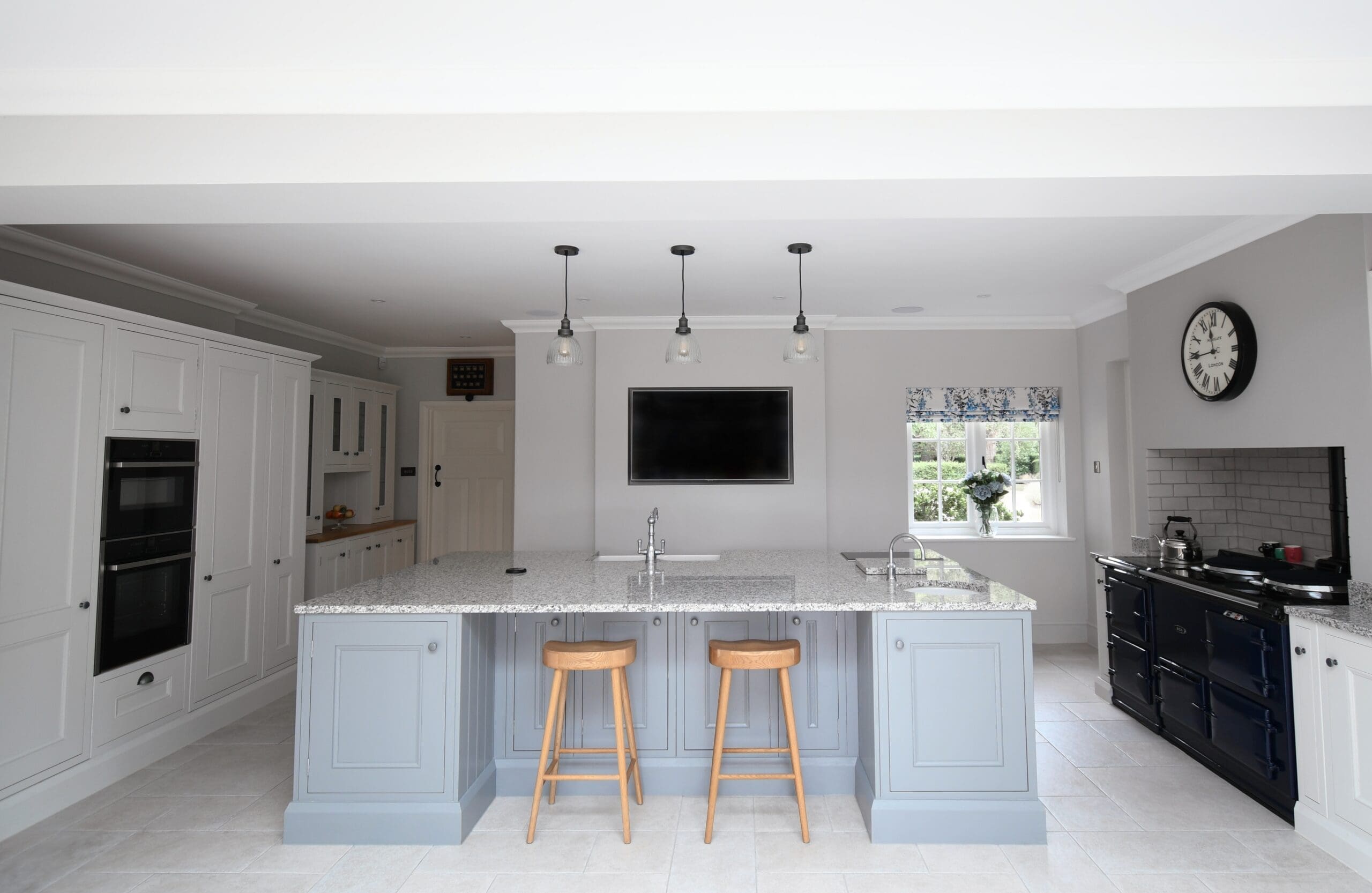 Dust Grey and Porcelain In-frame Shaker Kitchen with Central Island with wooden stalls and an aga oven