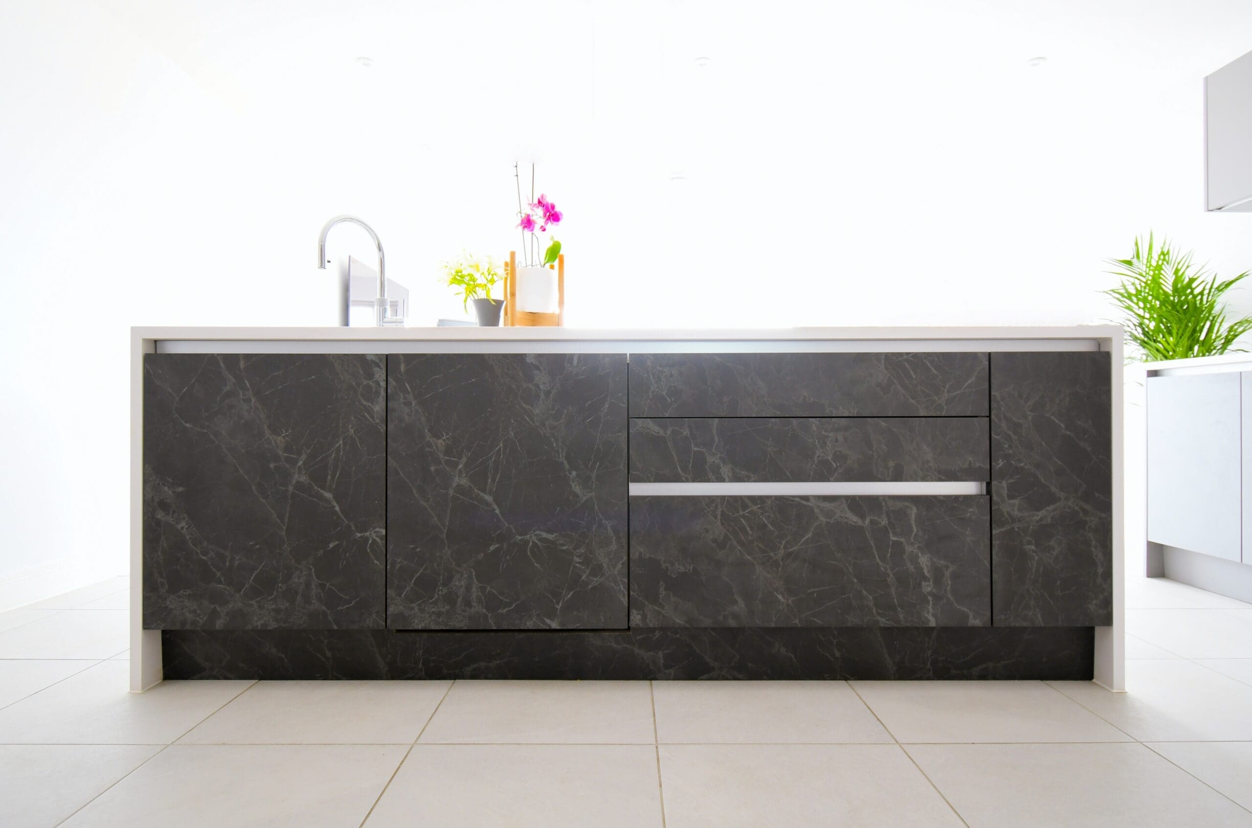 Black Marble True Handle-less Central Island with Neff Induction Hob with Island Extractor, Franke Sink and Quooker Tap Stonemill Kitchens