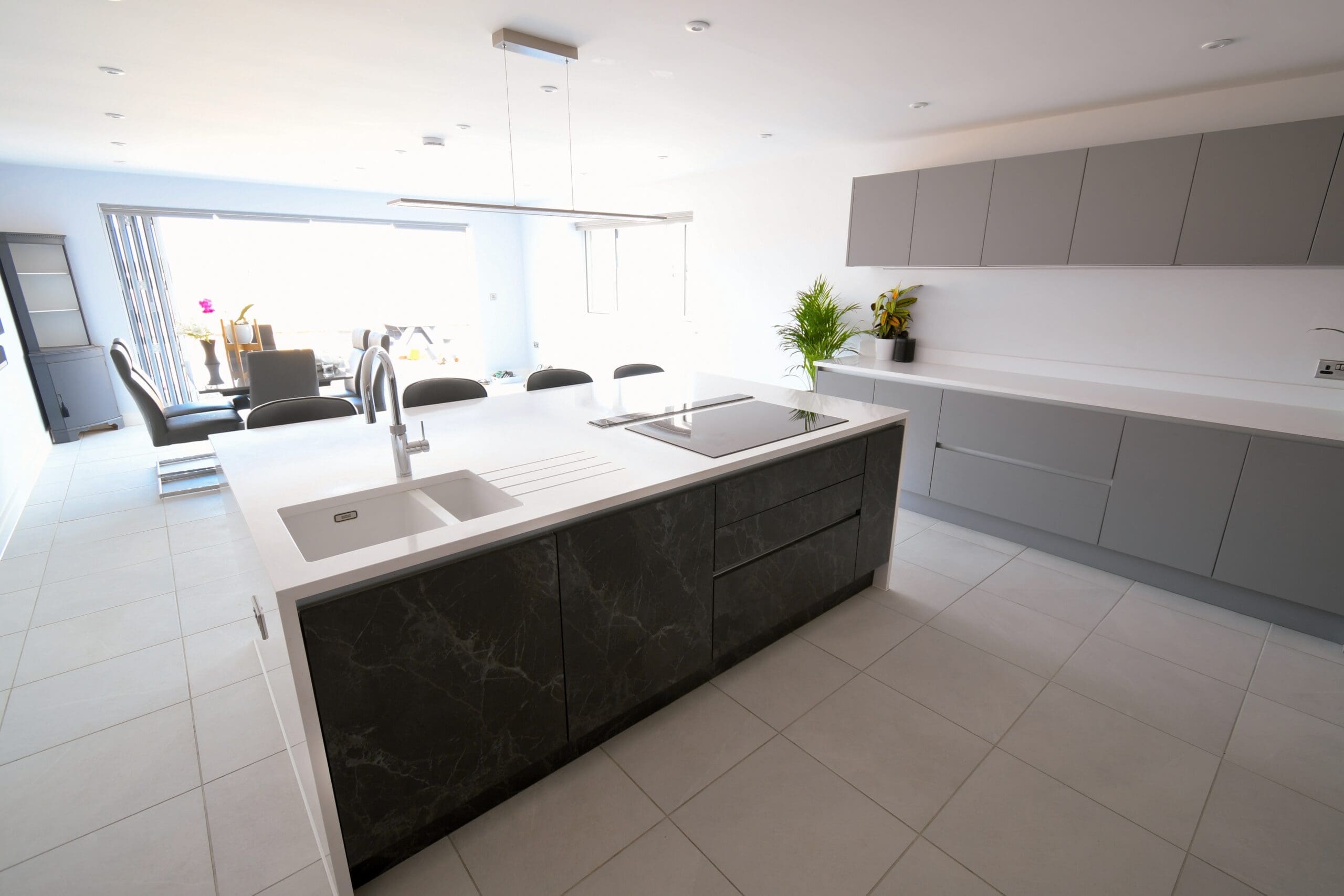 Black Marble True Handle-less Central Island with Neff Induction Hob with Island Extractor, Franke Sink and Quooker Tap Stonemill Kitchens