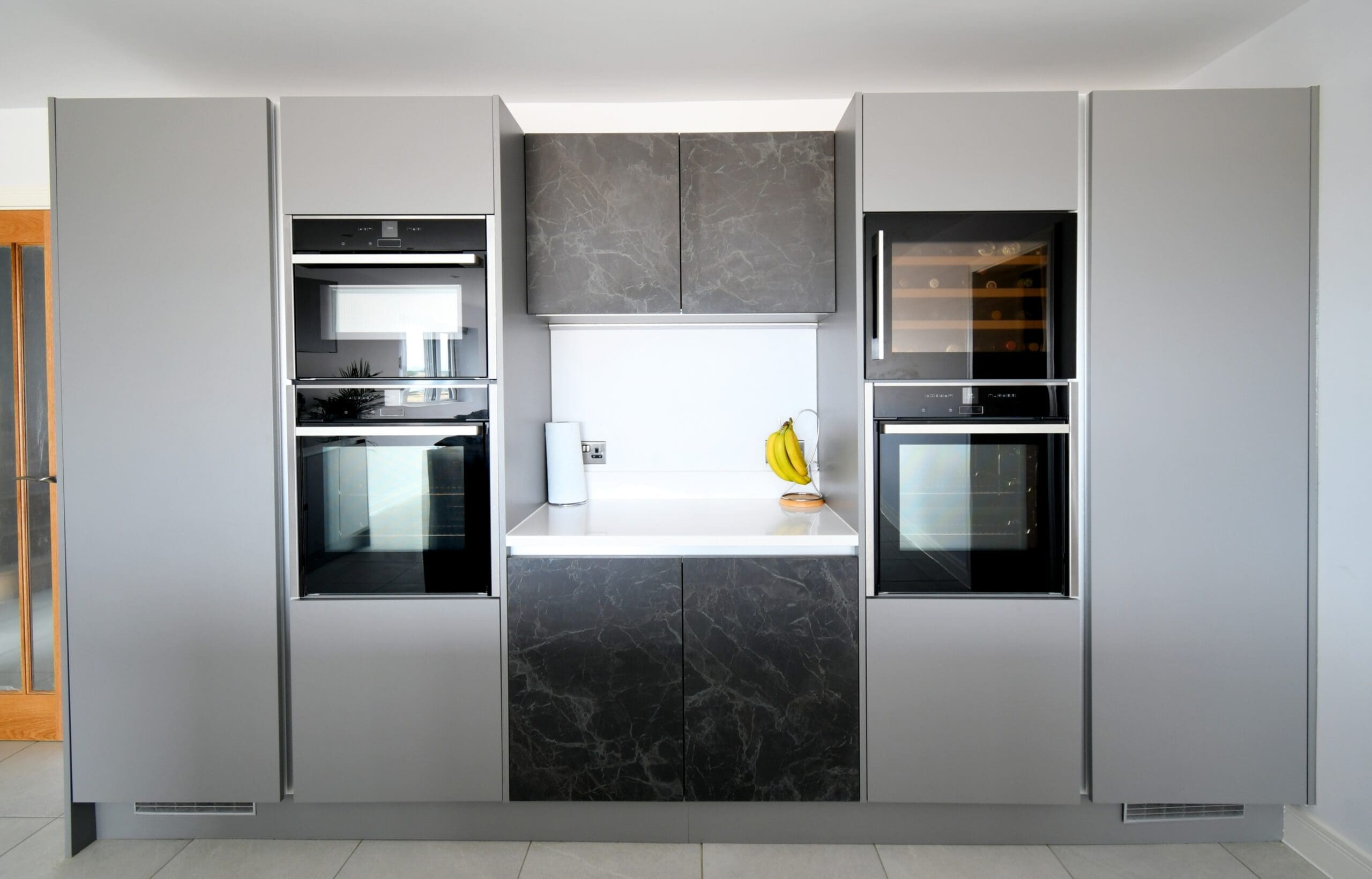 Black Marble and Light Grey True Handle-less Central Island with Neff Ovens Stonemill Kitchen