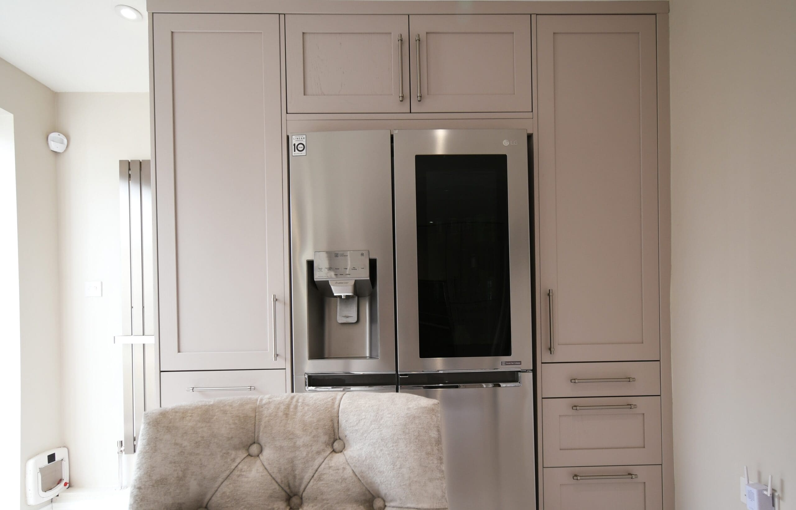 Cashmere Skinny Shaker Kitchen Granite Worktop Two Single Pantrys with Oak Spice Rack and Drawers American LG Fridge Freezer Stonemill Kitchens