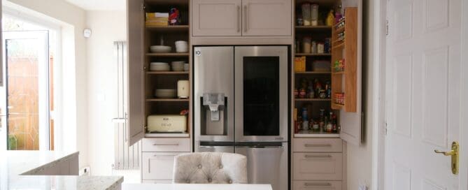 Stonemill Kitchens Cashmere Skinny Shaker Kitchen Granite Worktop Two Single Pantrys with Oak Spice Rack and Drawers. with american style fridge freezer